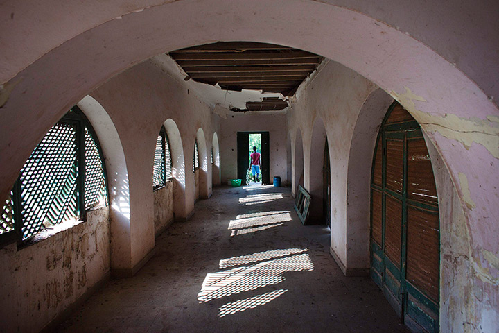 FTA: Joe Penney: A man leaves the abandoned colonial governor's mansion on Bolama