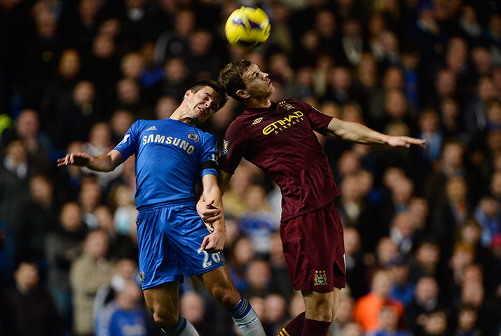 chelsea v citah: César Azpilicueta and Edin Dzeko go up for a header