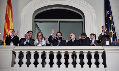 Artur Mas celebrating the CiU party winning the Catalonia election with his wife and supporters.