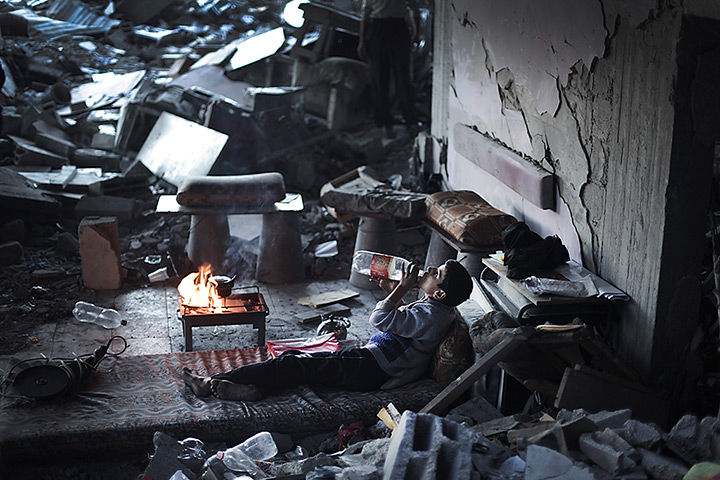 24 hours: Beit Lahiya, Gaza Strip: A Palestinian boy sits among the rubble