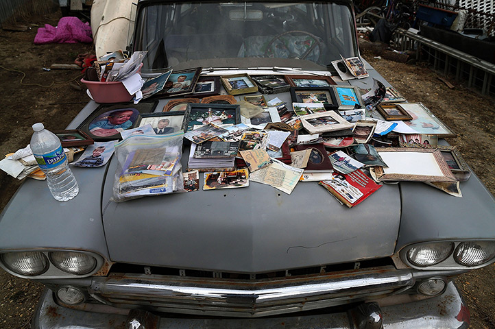 24 hours: Seaside Heights, New Jersey, US: Old photographs are laid out to dry 
