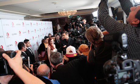 Photographers take pictures of actress Lindsay Lohan