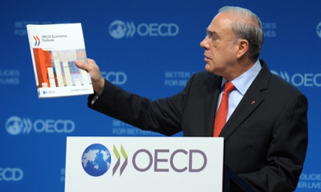 OECD Secretary General Angel Gurria presents the OECD Economic Outlook at the OECD headquarters in Paris on November 27, 2012.