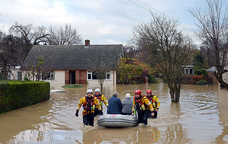 Residents rescued floods: An elderly couple are evacuated in St Asaph