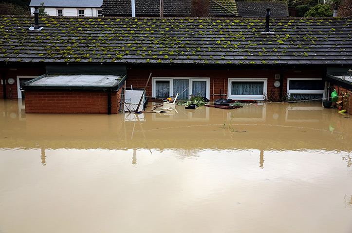 Residents rescued floods: Floodwater encompasses a house in St Asaph