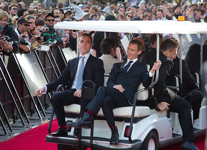 The Hobbit premiere: Actors Jed Brophy and James Nesbitt relax on the back of a golf cart 