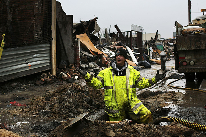 24hours in pictures: A worker Department of Environmental Protection works on the sewer system