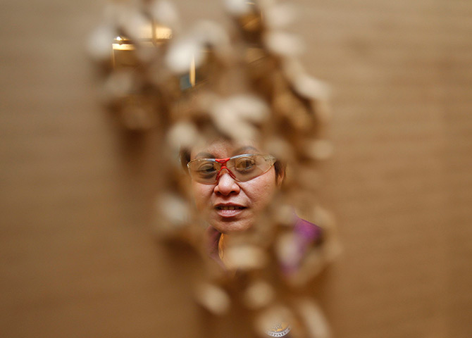 24hours in pictures: Kim Henares inspects her target board during target shooting