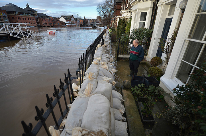 Floods clear-up: Sandbags and pumps next to the River Ouse in York