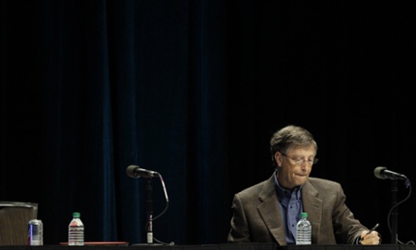 Microsoft's founder and chairman Bill Gates takes notes during the corporation's annual meeting of shareholders in Washington.