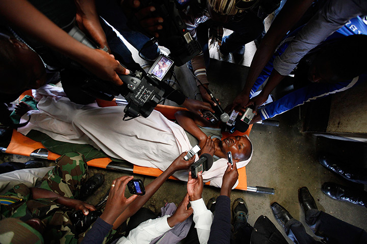 24 hours in pictures: Journalists interview a wounded FDLR rebel fighter 