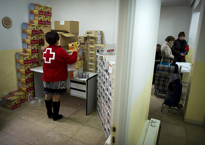FTA: Jasper Juinen: A Red Cross worker arranges boxes of biscuits