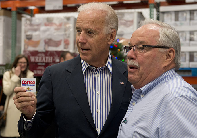 biden-at-costco: US Vice President Joe Biden holds up his