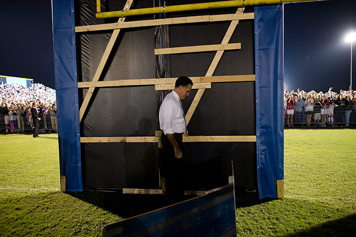 Twenty Photos: Mitt Romney ready to enter a rally at Land O'Lake High School, Florida