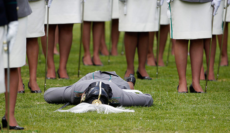 Twenty Photos: A cadet on the grass after collapsing during an annual ceremony in Bogota