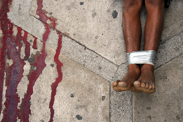 Mexico drug wars gallery: Closeup of one of the corpses of two murdered men 