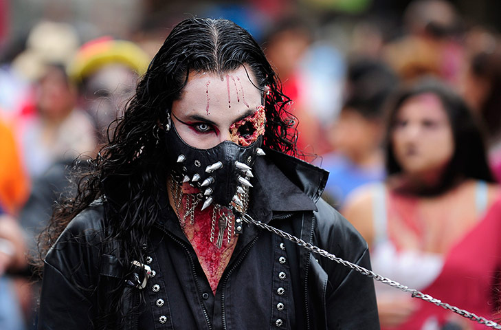 Zombie walk: A man is walked through the city on a lead