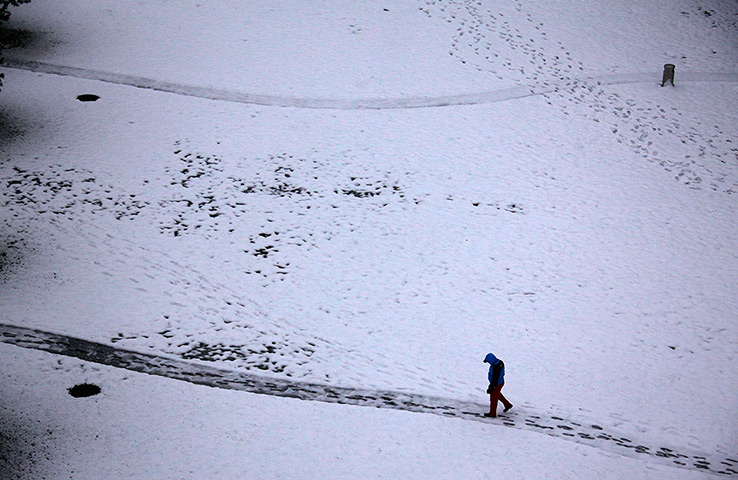 24 hours in pictures: overnight snowfall  in central Beijing