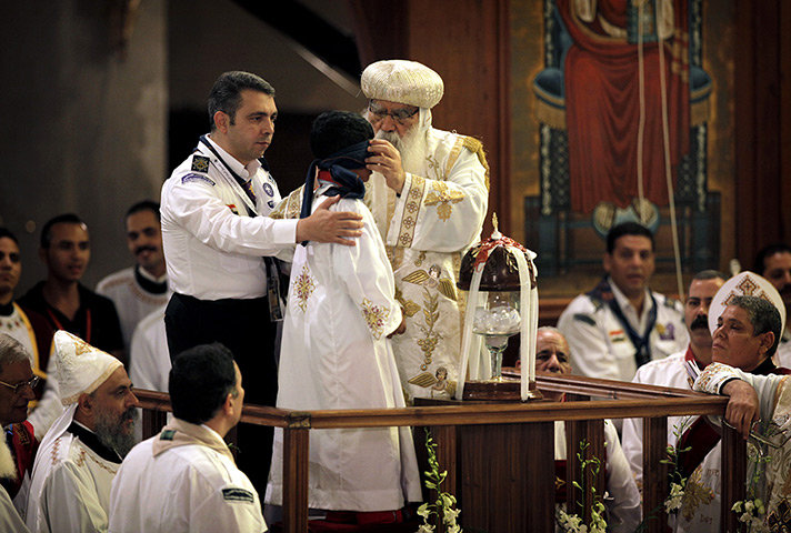 coptic pope elected: Acting Pope Pachomios blindfolds Bishoy Girgis Masaad