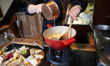 Making cheese Fondue at L'Art du Fromage restaurant, Chelsea