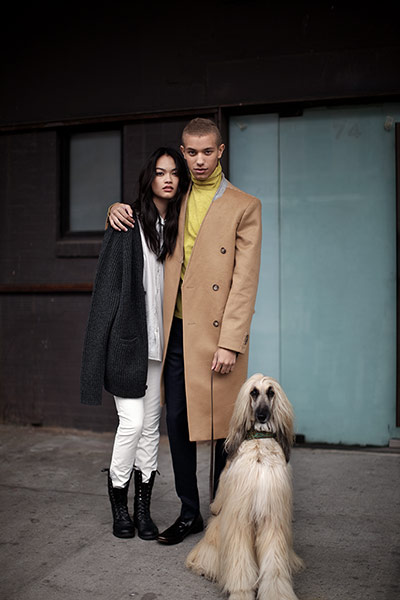Fashion: H&M in NY: Male and female model posing with a dog