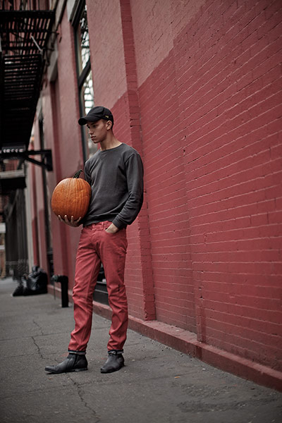 Fashion: H&M in NY: Male model posing with a pumpkin on a New York street