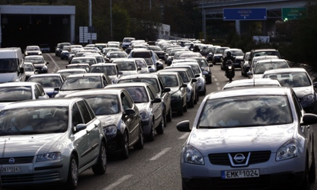Queues of vehicles jam Athens' ring road as public bus workers in the capital joined taxi drivers, metro, tram and train workers in the 48-hour strike, paralysing traffic, on November 6, 2012.  