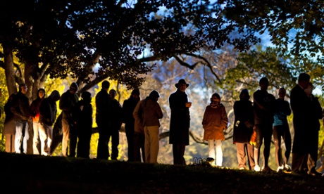 Virginia residents wait in line in the early hours to vote in the at Nottoway Park in Vienna, Virginia