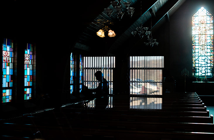 24 hours: Ohio, US: A voter is reflected in the window of a chapel
