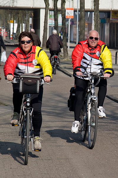 Big Picture: Couples: A couple dressed in matching red, yellow and white jackets