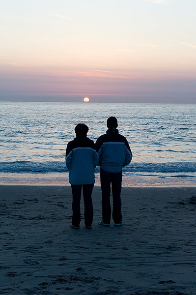 Big Picture: Couples: A couple dressed in matching blue and black jackets