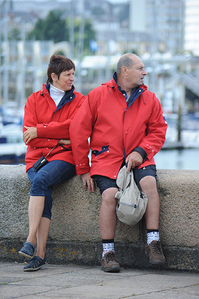 Big Picture: Couples: A couple dressed in matching red waterproof jackets