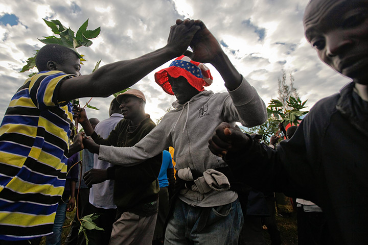 World election reaction: Kogelo, Kenya: Supporters dance after watching the news coverage 