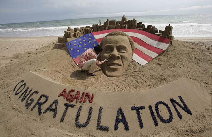 World election reaction: Puri, India: Sand sculpture Barack Obama on beach