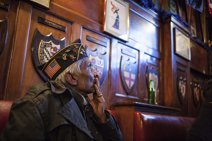 World election reaction: Paris, France: A man watches the broadcast on a television 