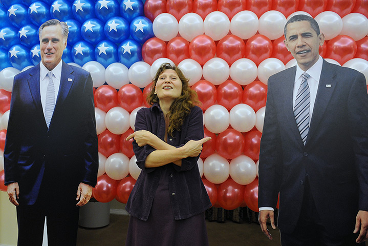 World election reaction: Moscow, Russia: A woman poses for a photo with cardboard figures