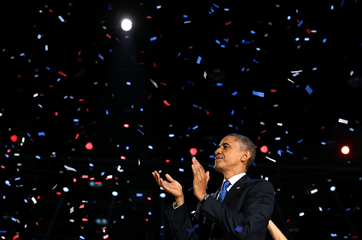 World election reaction: Chicago, USA: President Barack Obama stands on stage and applauds