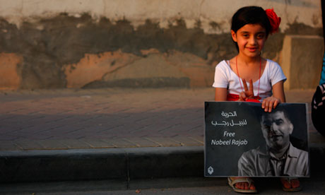 A girl holds a poster calling for the release of Nabeel Rajab in Bahrain. Photograph: Ammar Photography/Demotix/Corbis