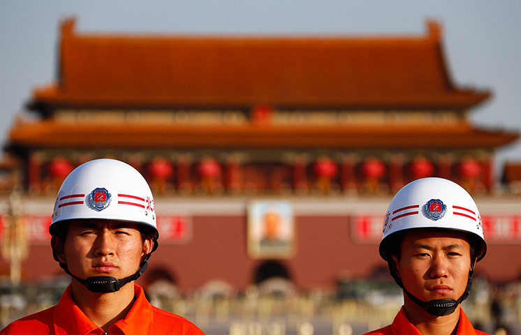 China national congress: Firefighters stand on the Tiananmen Square next to the Great Hall