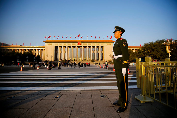 China national congress: A paramilitary police officer stands guard on Tiananmen Square