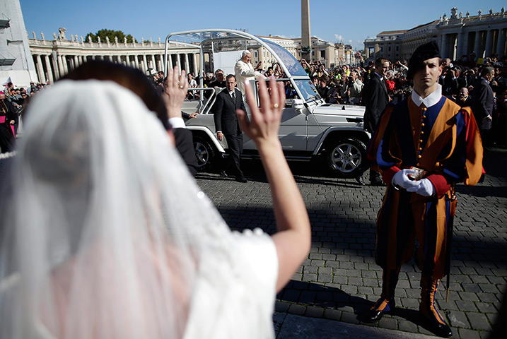 24 hours in pictures: Pope Benedict XVI waves in Saint Peter's square at the Vatican
