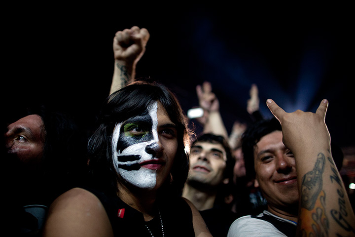 24 hours in pictures: Kiss rock band's fans wait for the start of a Kiss concert