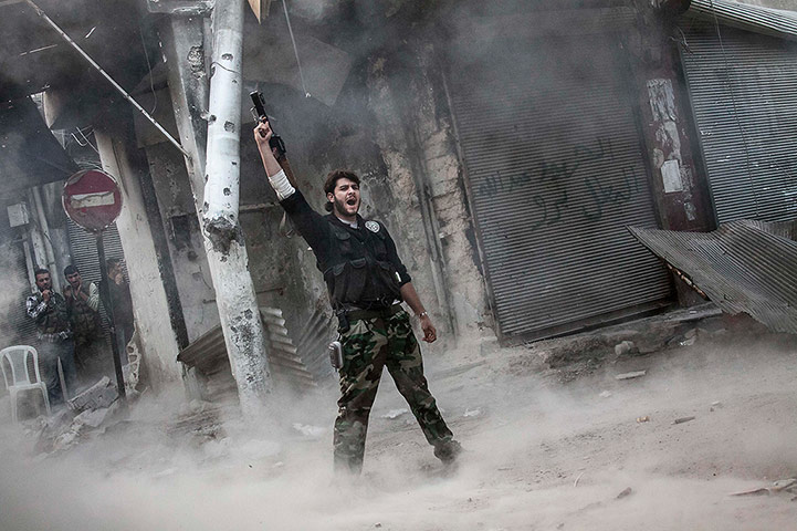 From The Agencies: A rebel fighter claims for victory after he fires a shoulder-fired missile