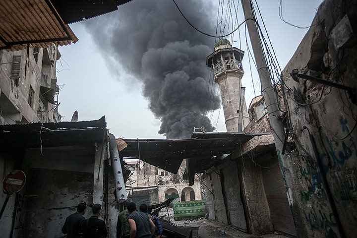 From The Agencies: Smoke rises after Syrian government forces fired an artillery round