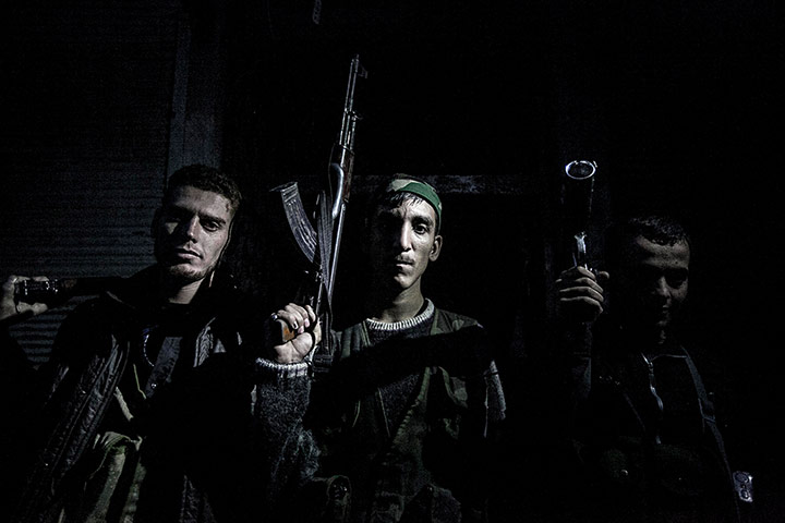 From The Agencies: Rebel fighters belonging to the Liwa Al Tawhid unit pose for photo