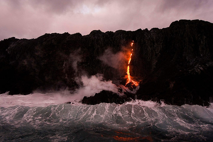 20 Photos: Waves crash over lava near Volcanoes National Park in Kalapana, Hawai
