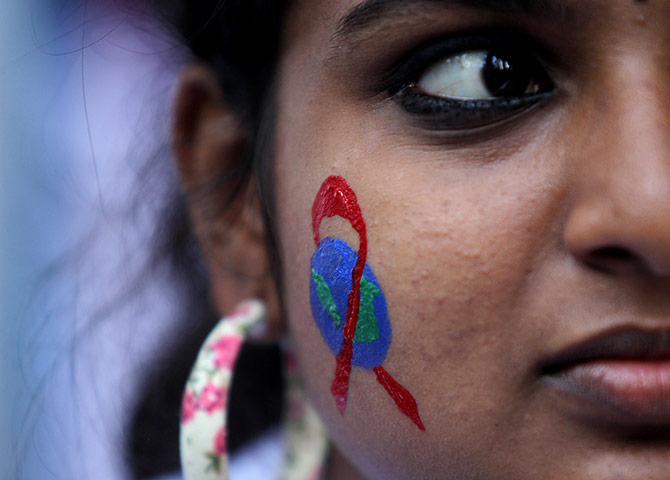 World AIDS Day: A Malaysian woman has her face painted