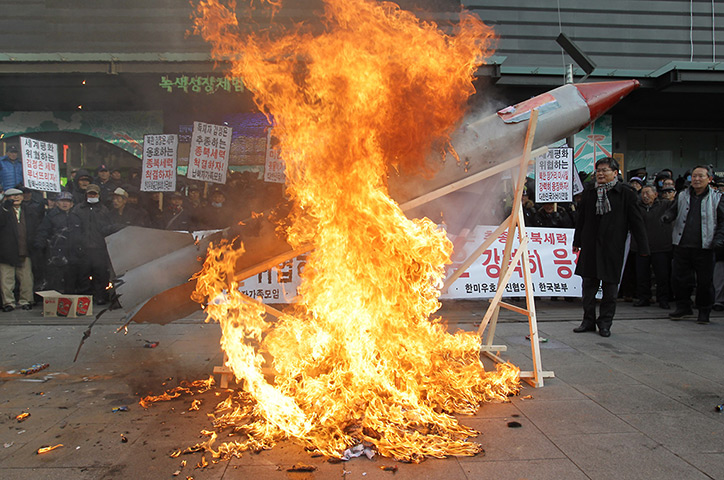 North Korea missile: South Korean conservative protesters burn a mockup of a missile 