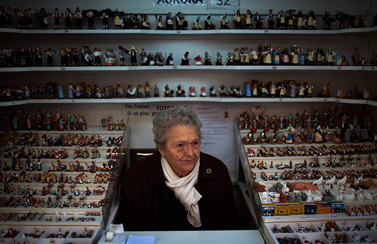 24 hours: Barcelona, Spain: A woman waits for customers