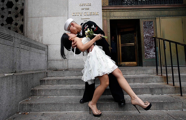 December 12 2012: U.S. Navy Petty Officer  kisses his new bride 